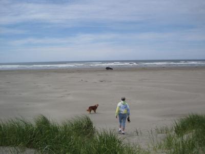 Walking from a geocache in the dunes out to the Jeep