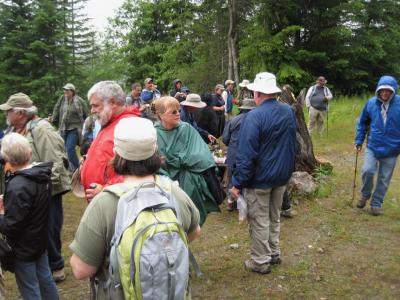 A crowd waiting to sign the cache log.