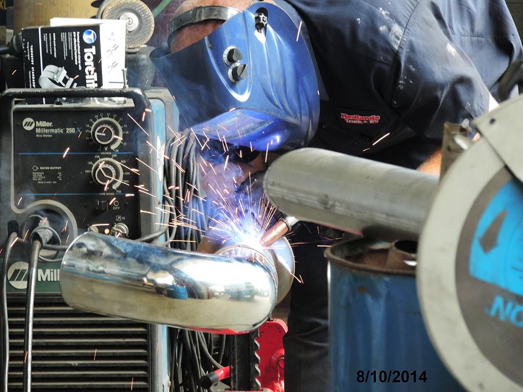 Welding top pipe to muffler